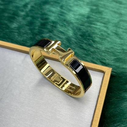 Hermèss H noir dore